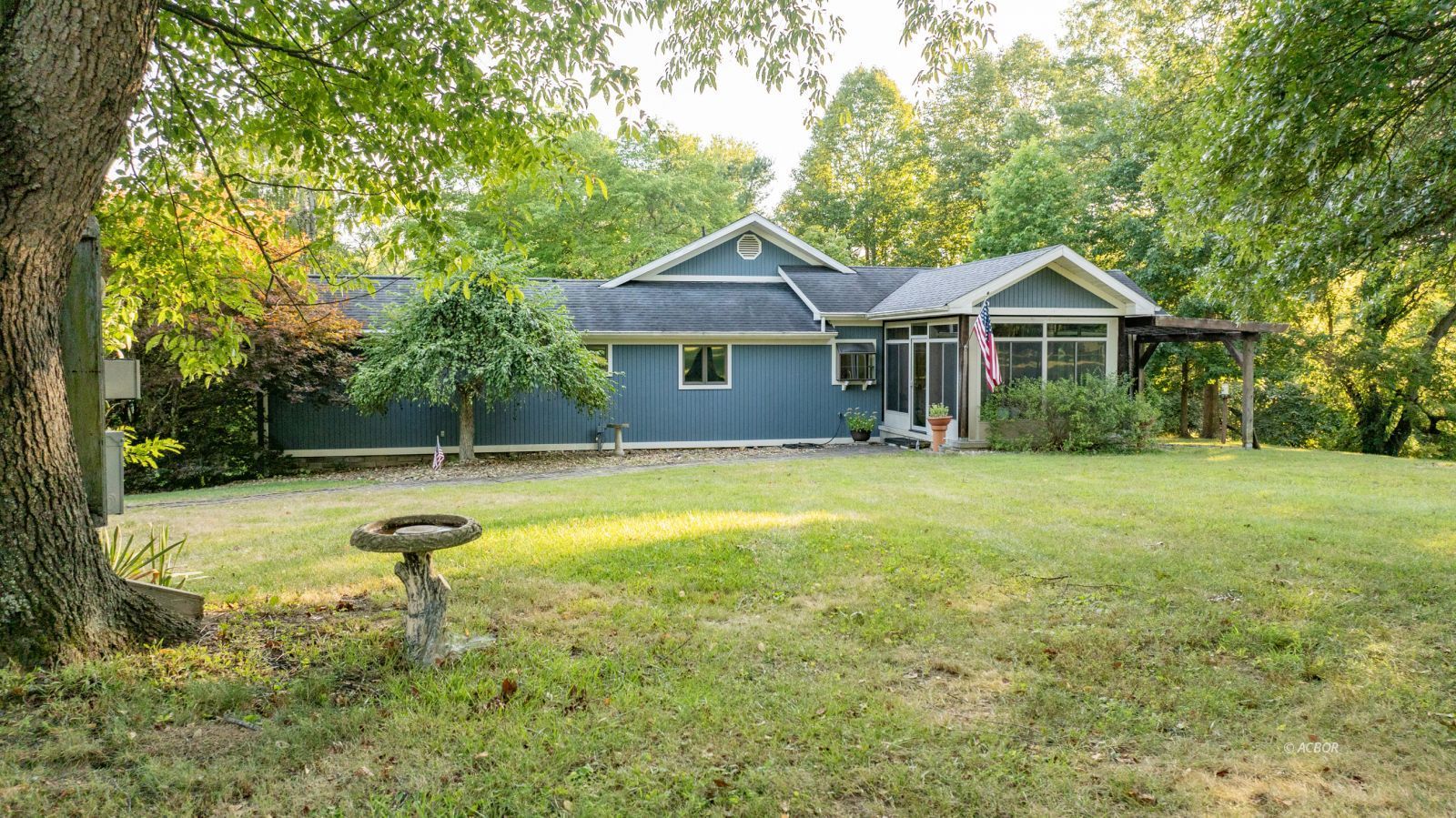 Front of house w/ screened in porch