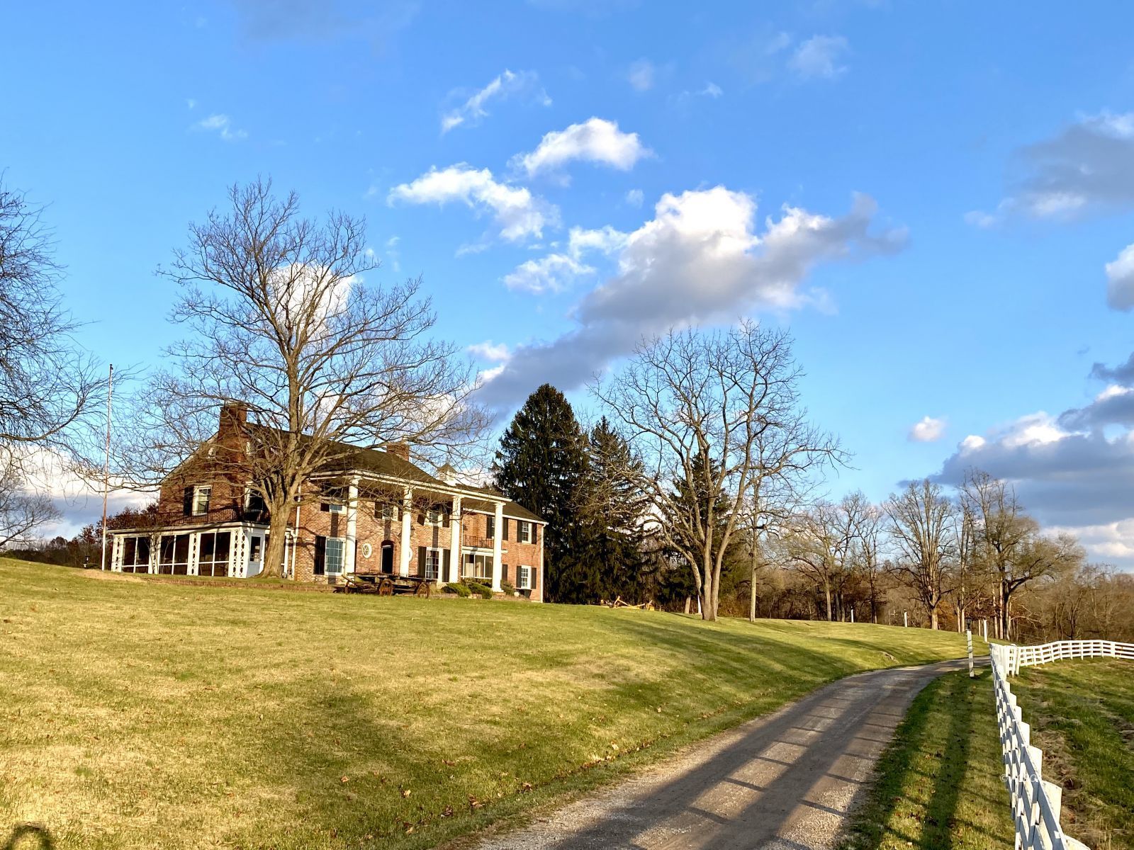 Driveway entrance view of house