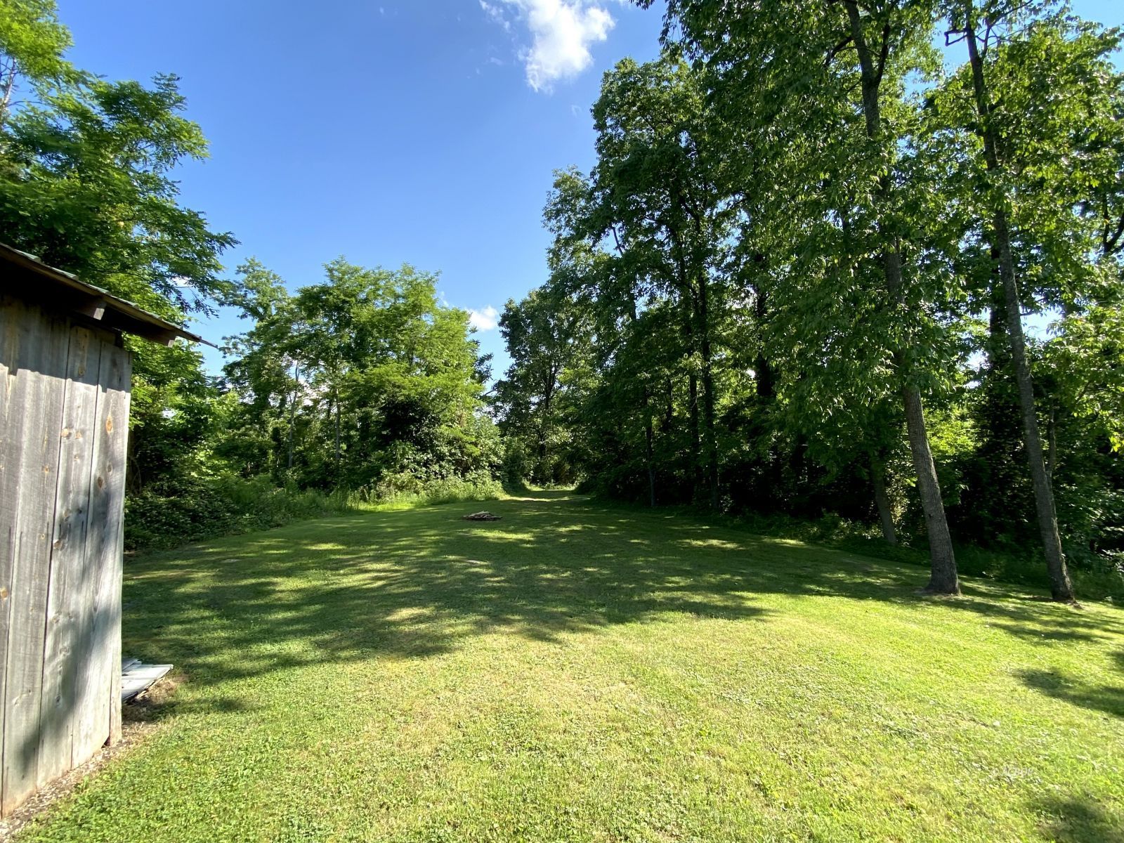 View of trail beyond garage